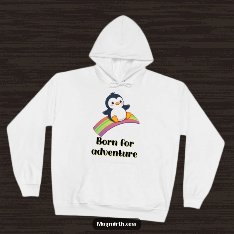 Funny Hoodie: A cozy sweatshirt depicting a penguin happily sliding down a vibrant rainbow.