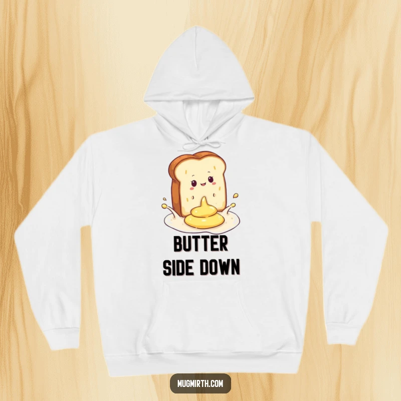 Funny hoodie depicting a dramatic splash as toast lands in a pool of butter, a hilarious and cozy apparel choice.