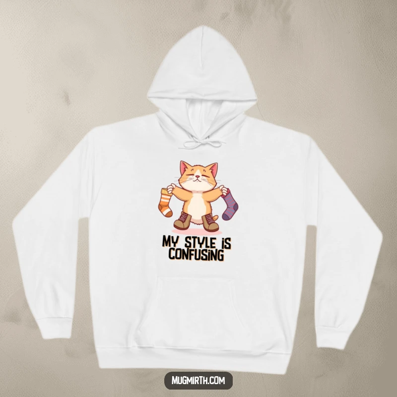 Funny hoodie design: a bewildered cat in large boots attempts to juggle three socks, exuding comical confusion.