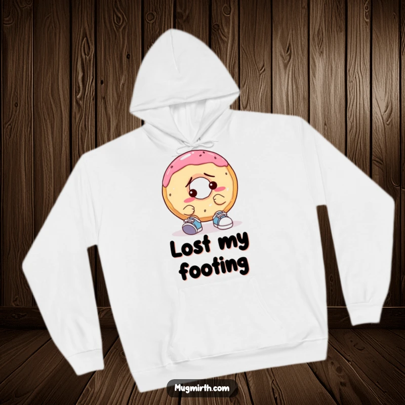 Funny Confused Donut Hoodie: A warm hoodie displaying a donut struggling adorably with a pair of comically small shoes, looking quite puzzled.