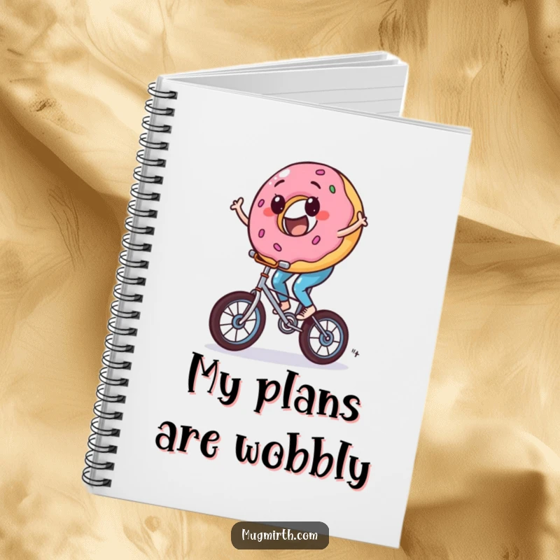 Funny donut notebook, a sweet character riding a tiny unicycle with wobbles, perfect for notes and doodles.