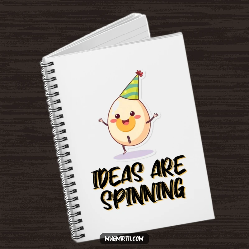 Funny notebook with a smiling egg in a party hat attempting a cartwheel, a humorous stationery item for jotting ideas.