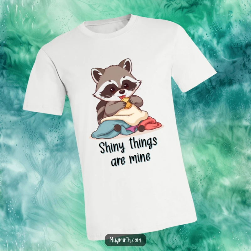 Funny Raccoon T-Shirt: A mischievous raccoon is caught red-handed stealing a solitary shiny button from a heap of clothing.