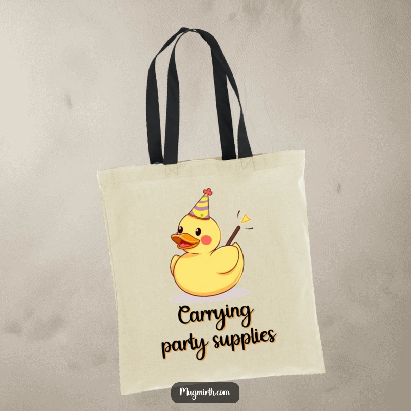 Funny tote bag graphic: a rubber duck with a party hat is launched from a slingshot, perfect for carrying cheer.